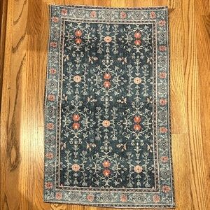 Elegant Blue and Red Patterned Rug